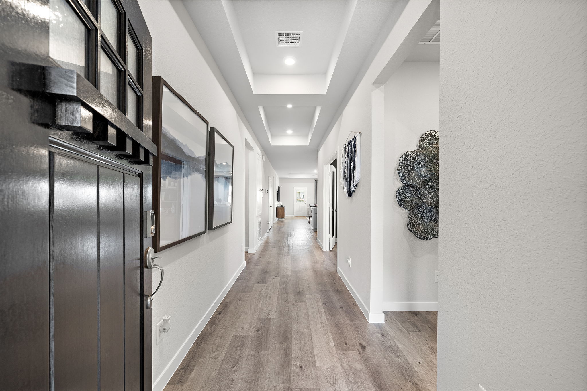 A long hallway with doors.