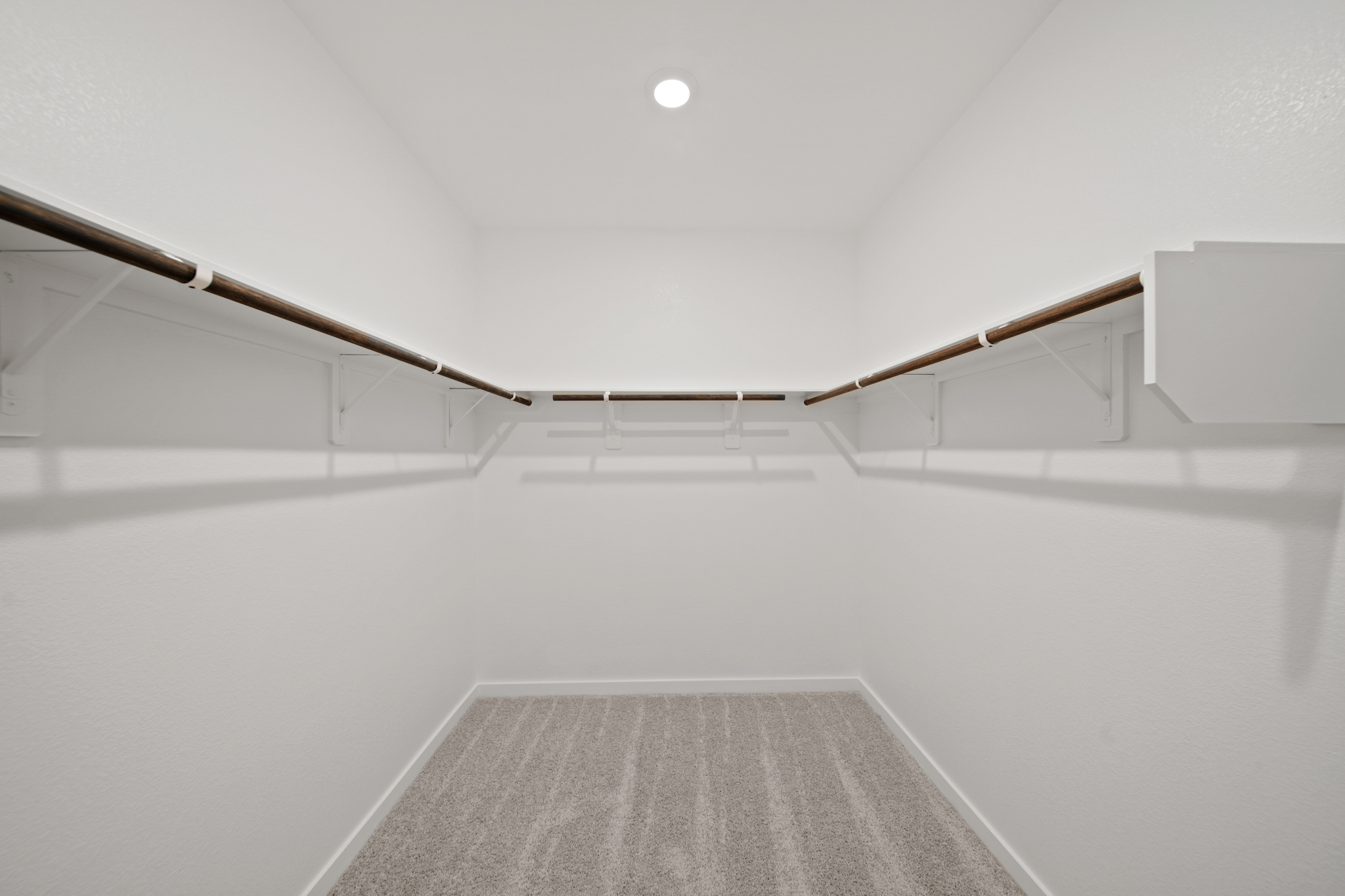 A white room with a staircase.