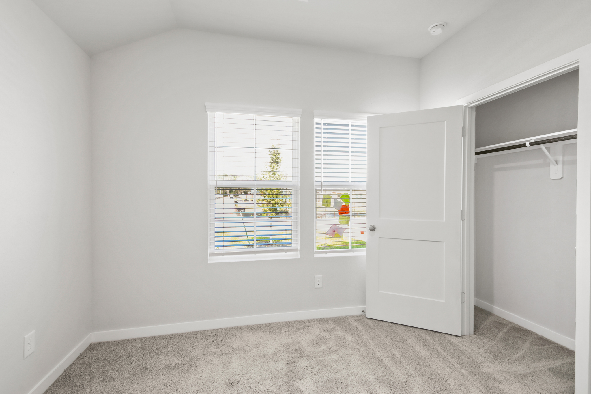 A room with a window and a door.