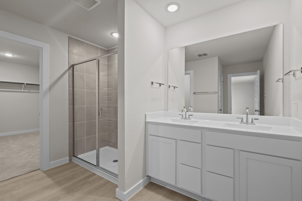A bathroom with a glass shower.
