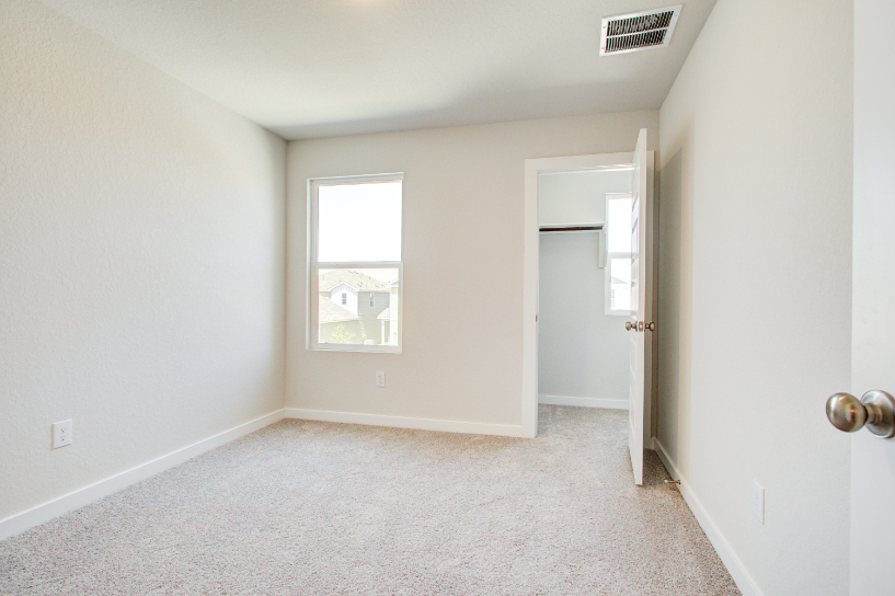 A room with a door and a window.