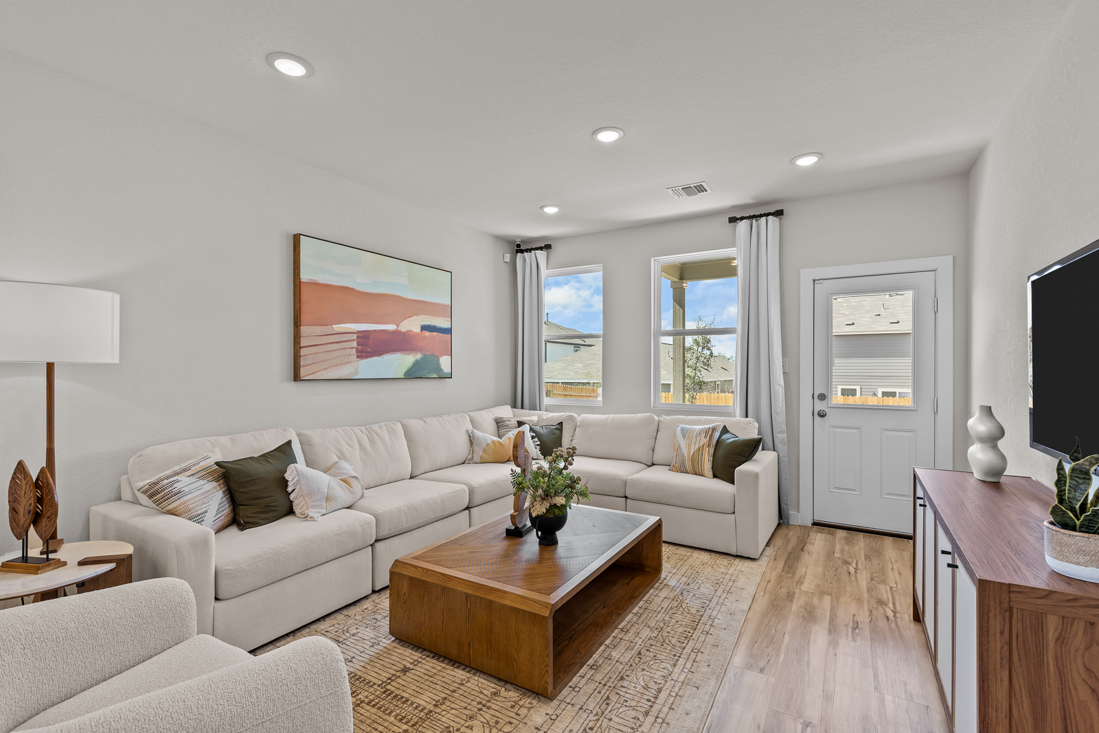A living room with a white couch.