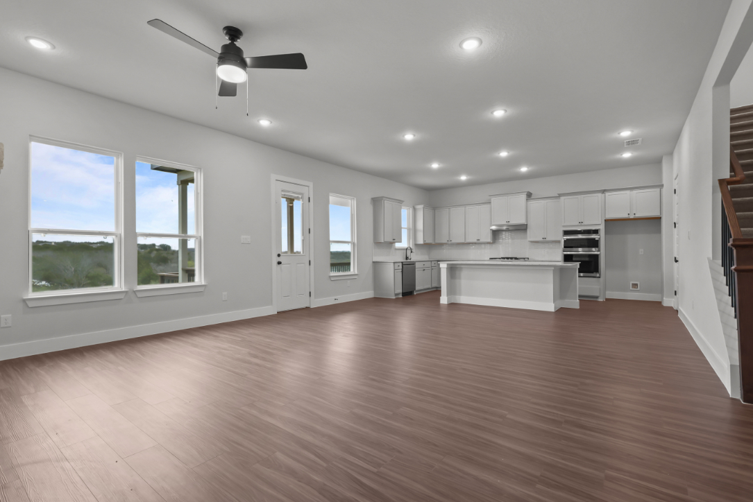 A large kitchen with white cabinets.