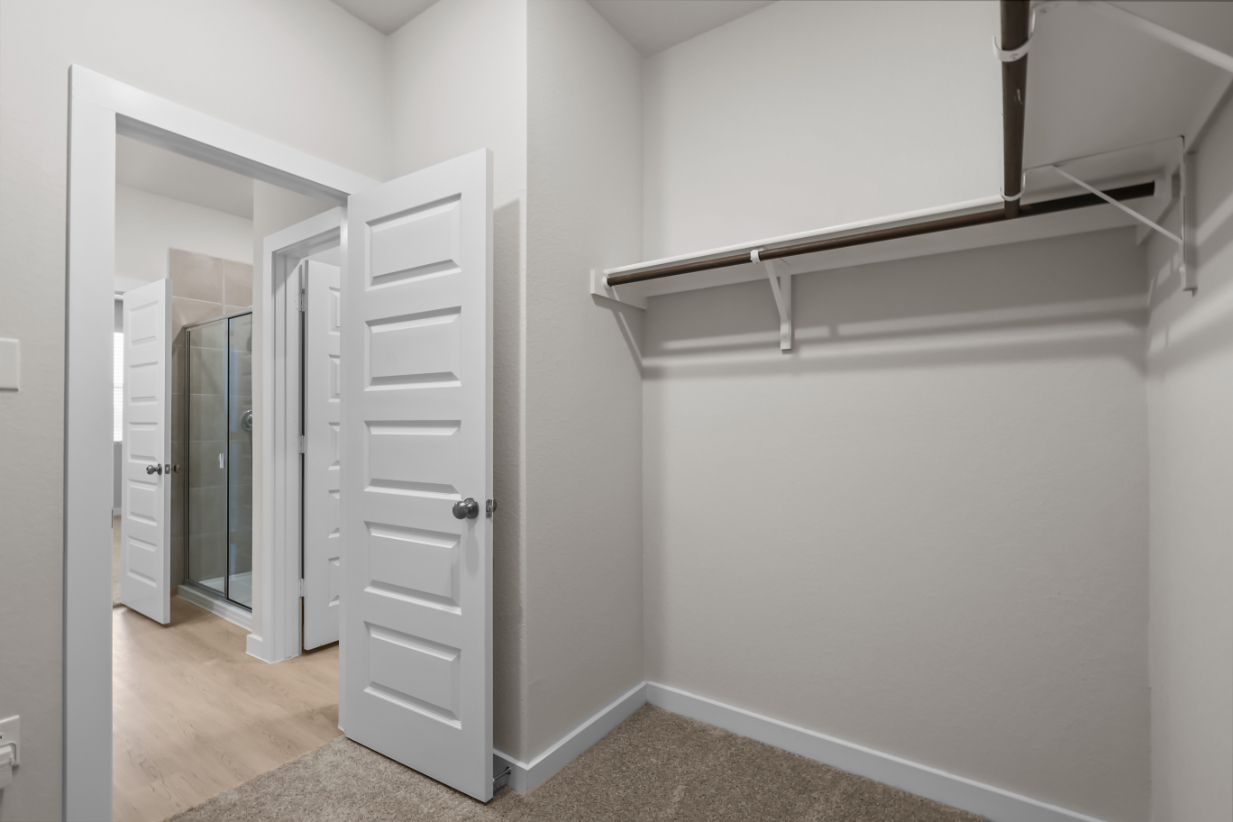 A room with white cabinets.