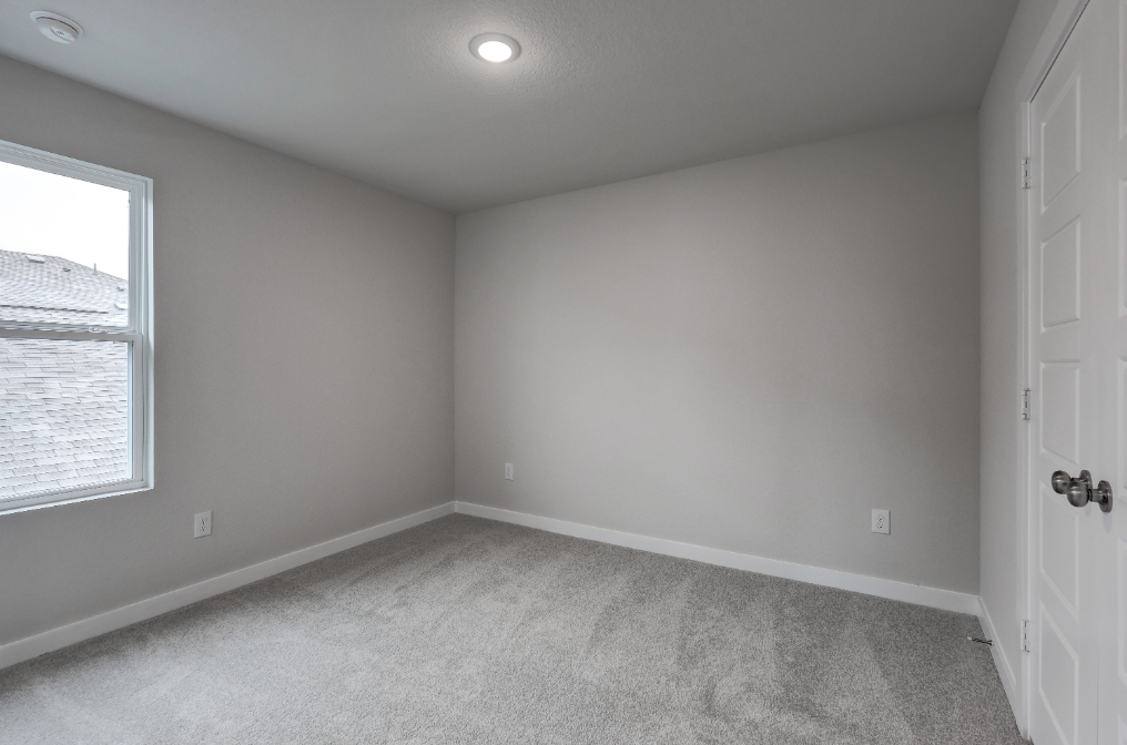 A room with a door and a window.