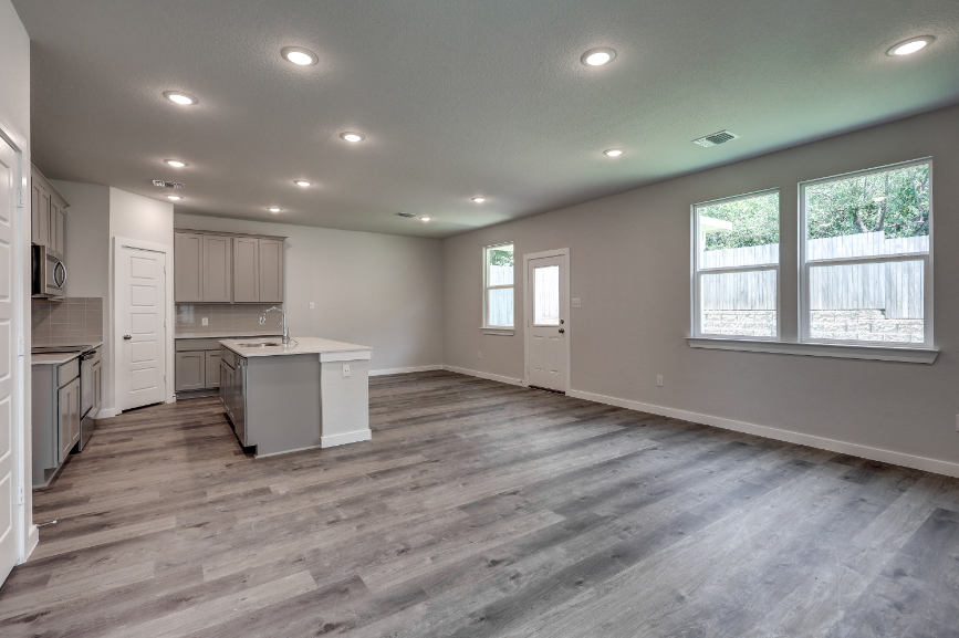 A kitchen with wooden floors.