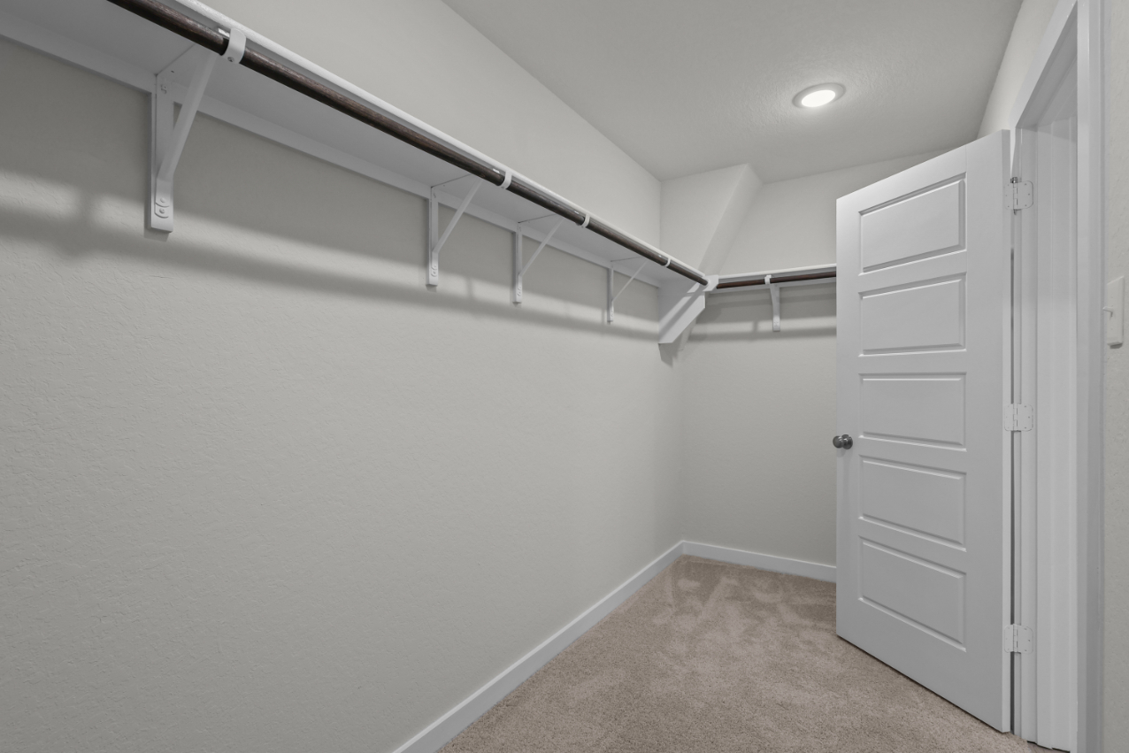 A hallway with white doors.