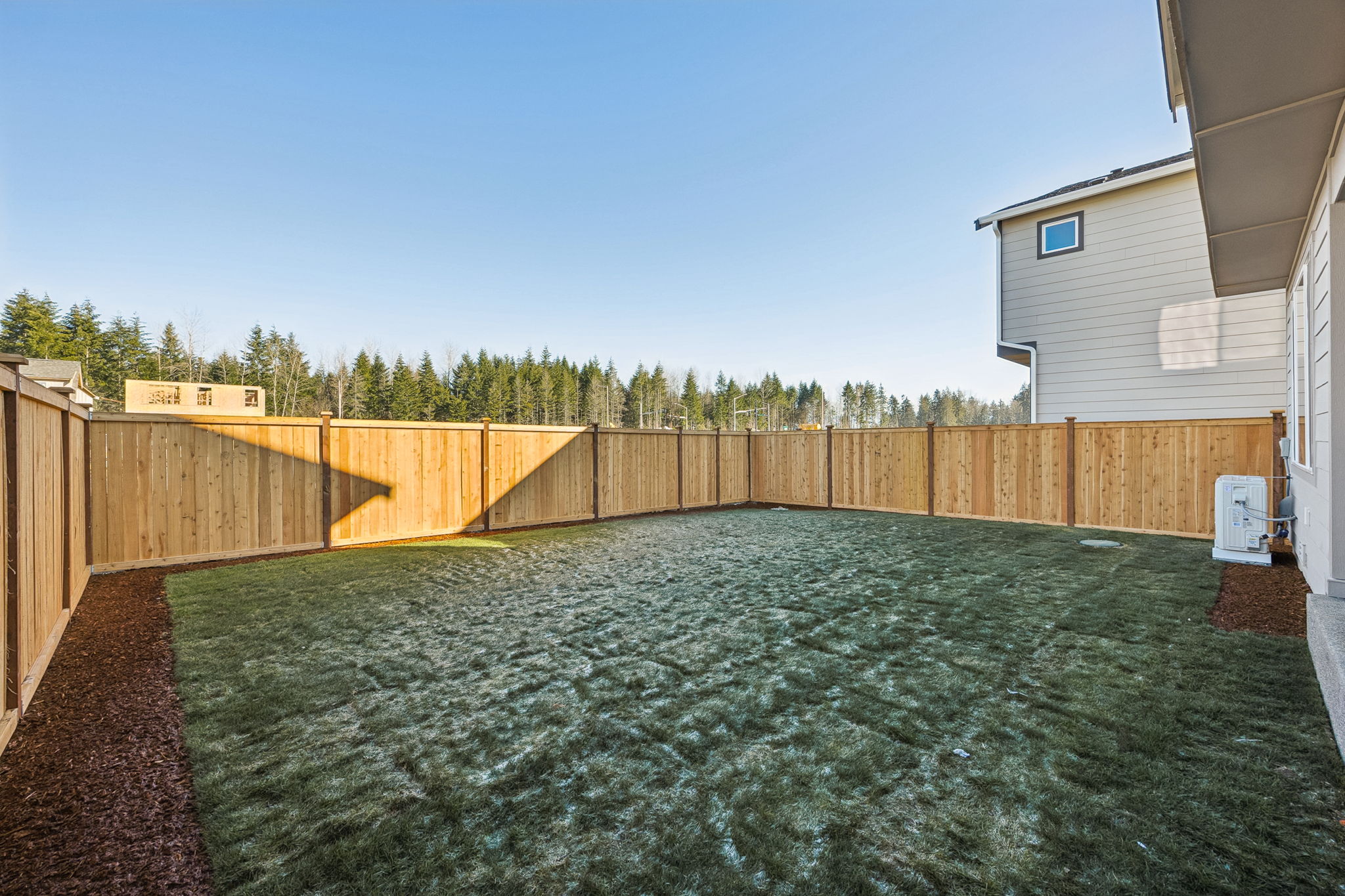 A pool of water next to a building.