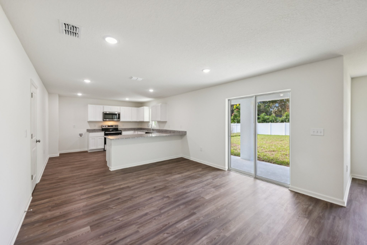 A kitchen with white walls.