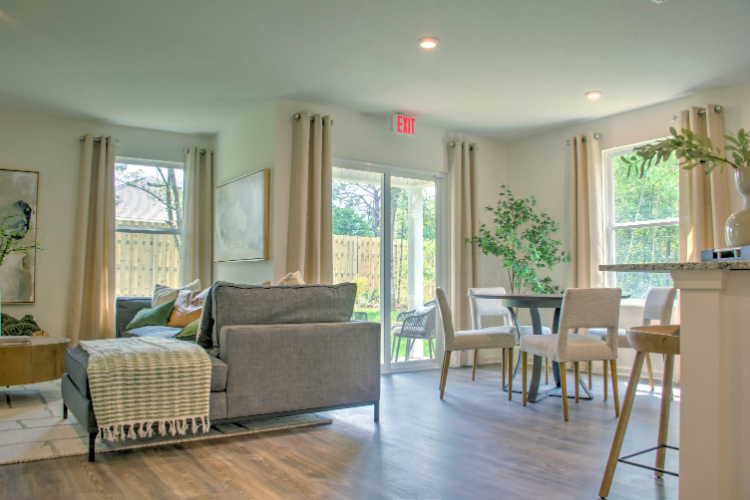 A living room with a wood floor.