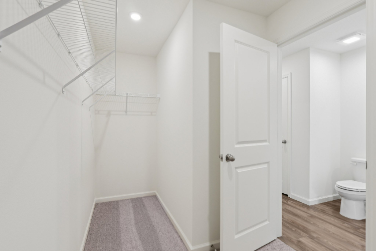 A bathroom with white walls.