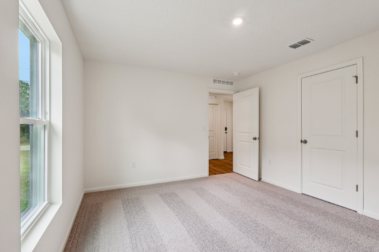 A hallway with white doors.