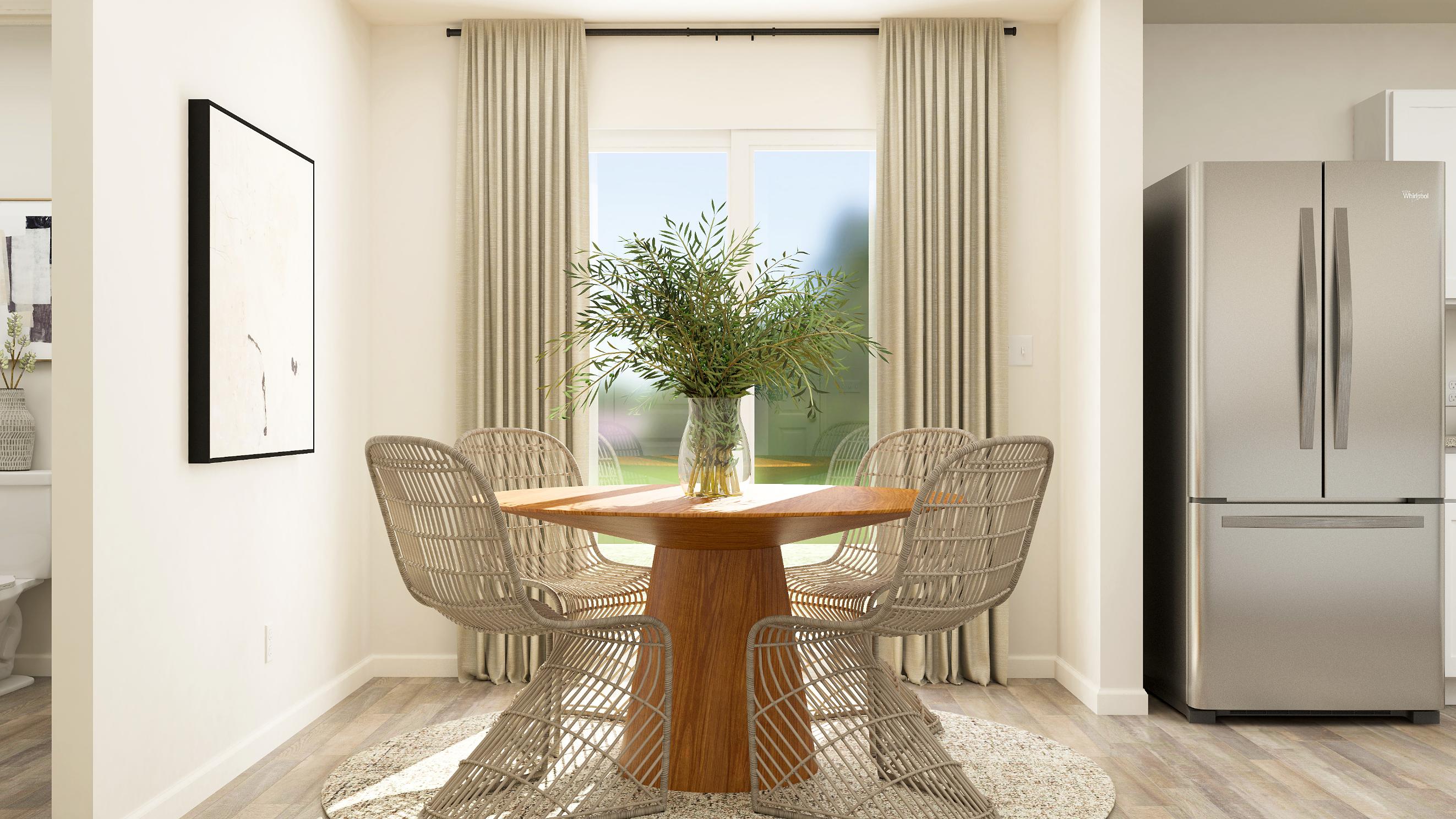A dining room table with chairs.